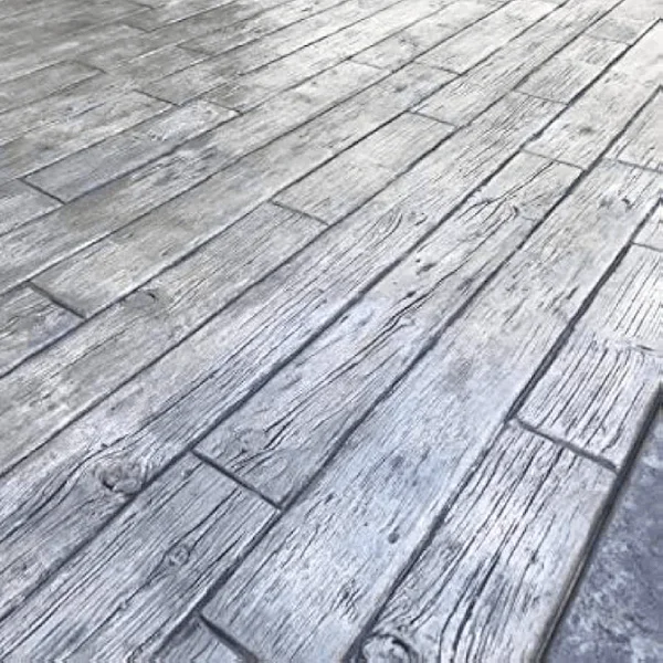 Stamped concrete patio with wood-grain herringbone pattern in gray tones
